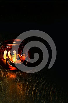 Halloween pumpkin head bowl lantern on dark background