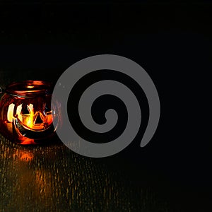 Halloween pumpkin head bowl lantern on dark background