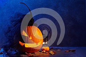 Halloween pumpkin head jack lantern with bride hat in dark barn