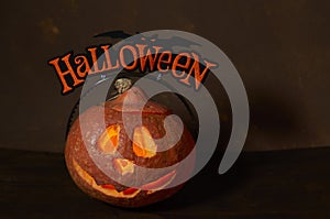 Halloween pumpkin head lantern on wooden background . Jack-o-lantern carved pumpkins for Halloween close up. Halloween pumpkin