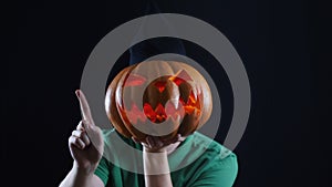 Halloween. Pumpkin head showing not allowing gesture.
