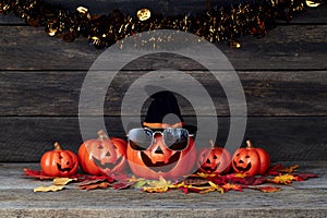 Halloween pumpkin lantern. Trick or treat on a wooden table