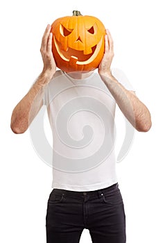 Halloween pumpkin on man head, joking