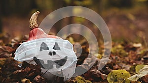 Halloween pumpkin in medical mask
