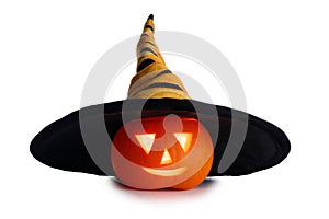 Halloween pumpkin in oversized hat