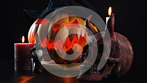 Halloween. Pumpkin, skull, candle, witch. Static camera