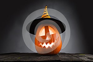 Halloween pumpkin with witches hat