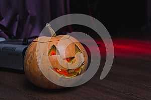 Halloween pumpkins background. Scary glowing faces trick or treat