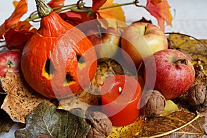 Halloween Pumpkins And Candle On Wooden, autumn composition with leaves and apples