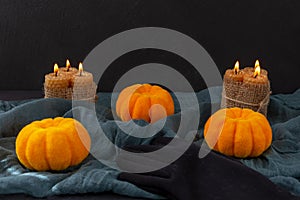 Halloween. Pumpkins, candles and black glove