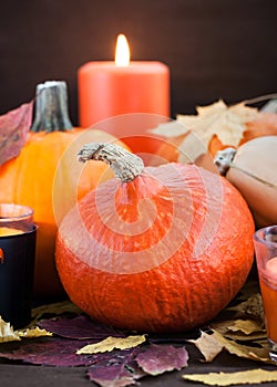 Halloween pumpkins and candles on dark