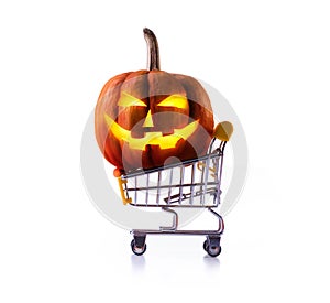 Halloween pumpkins in shopping cart isolated on white background