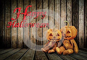 Halloween Pumpkins on wood background with message 'Happy Halloween'