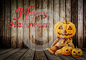 Halloween Pumpkins on wood background with message 'Happy Halloween'