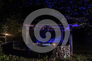 Halloween Pumpkins On Wood In A Spooky Forest At Night