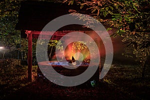 Halloween Pumpkins On Wood In A Spooky Forest At Night