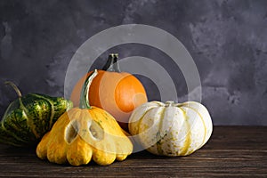 Halloween pumpkins on wooden table, place for text