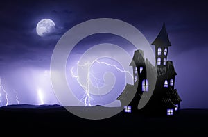 Halloween scary backgorund with haunted house and lightnings photo