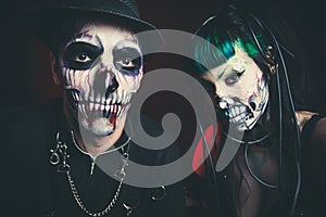 Halloween scary cyber skeleton woman and man with hat studio