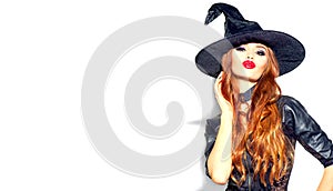 Halloween Sexy Girl wearing witch costume with a hat. Party, Celebrating. Beauty Woman with long hair and holiday bright makeup