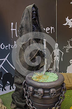Halloween skeleton in a raincoat with a vase in the turtles and chain