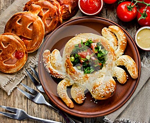 Halloween spider appetizer. Pizza dough baked spider vegetable s