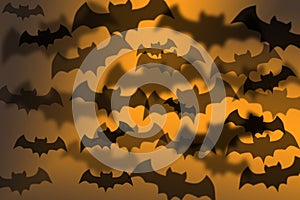 Halloween spooky pattern with black bats on orange background, graphic design photo