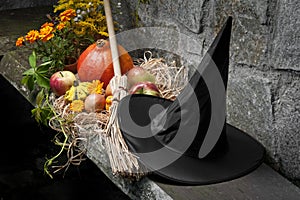 Halloween still life with pumpkins and witch hat