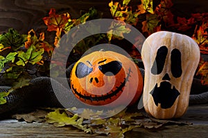 Halloween Stingy Jack pumpkins on dark rustic background photo