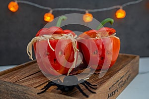 Halloween stuffed pepper monster heads on a plate