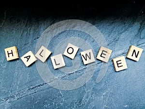 Halloween text on marble background