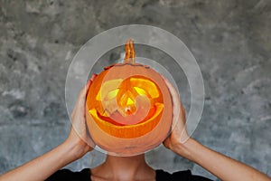 Halloween themed image with carved pumpkins in house party environment.