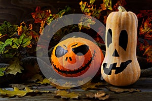 Halloween traditional jack-o-lantern and fall leaves