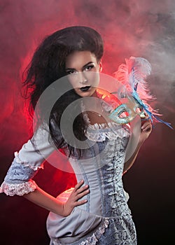 Halloween vampire woman with venetian mask