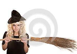 Halloween witch blond in black hat with broom.