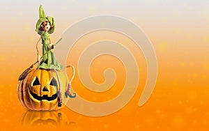 Halloween Witch and carved Pumpkin with magic lights. Copy space mock up