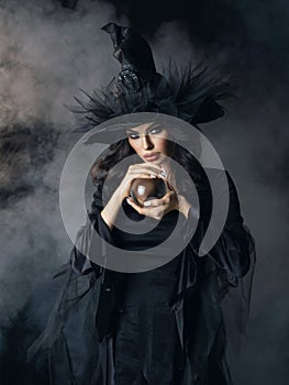 Halloween witch with crystal ball