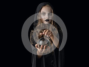 Halloween witch girl with crystal ball