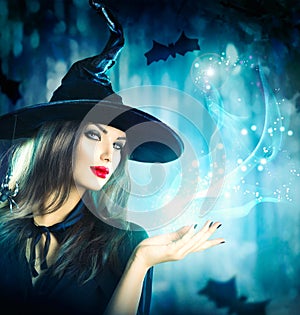 Halloween Witch holding magical light