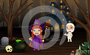 Halloween witch and mummy with scary house in the night