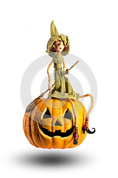 Halloween Witch sit on carved Pumpkin  on white background