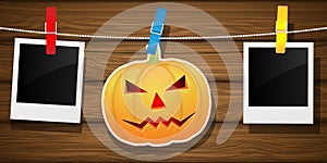 Hallowen background with pumpkin and blank photo frame.