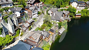 Hallstatt, Austria. Aerial view of the beautiful town from a flying drone over the lake in summer season