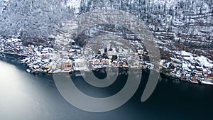 Hallstatt Austria, Aerial view on houses in small alpine village, mountains and lake winter time