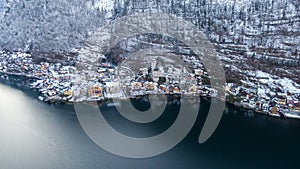 Hallstatt Austria, Aerial view on houses in small alpine village, mountains and lake winter time