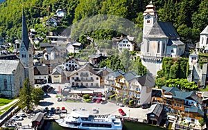 HALLSTATT, AUSTRIA - SEPTEMBER 3, 2021: Aerial view of the beautiful town from a flying drone over the lake in summer season