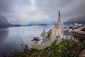 Hallstatt, Austria - The world famous Hallstatt, the Unesco protected lakeside town with Hallstatt Lutheran Church on a foggy day