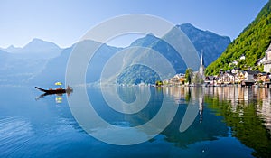 Hallstatt lakeside town with traditional Platte boat in summer, Salzkammergut region, Austria