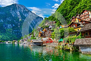 Hallstatt old town houses on green hill in Austria