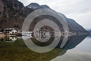 Hallstatt village and its reflection in Hallstatter see lake, Austria